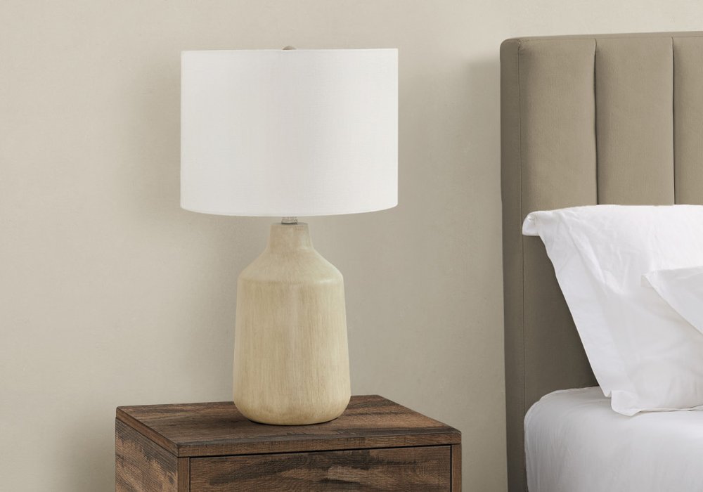 24" Beige Concrete Urn Table Lamp With Ivory Drum Shade close-up highlighting the ivory surface.