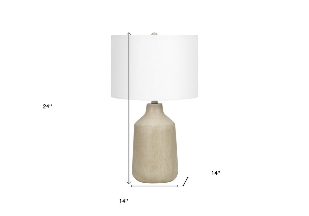 24" Beige Concrete Urn Table Lamp With Ivory Drum Shade. Table lamp isolated on a plain white background, finished in ivory.