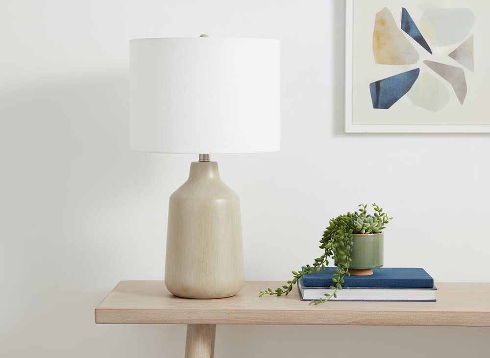 24" Beige Concrete Urn Table Lamp With Ivory Drum Shade. Table lamp in ivory.