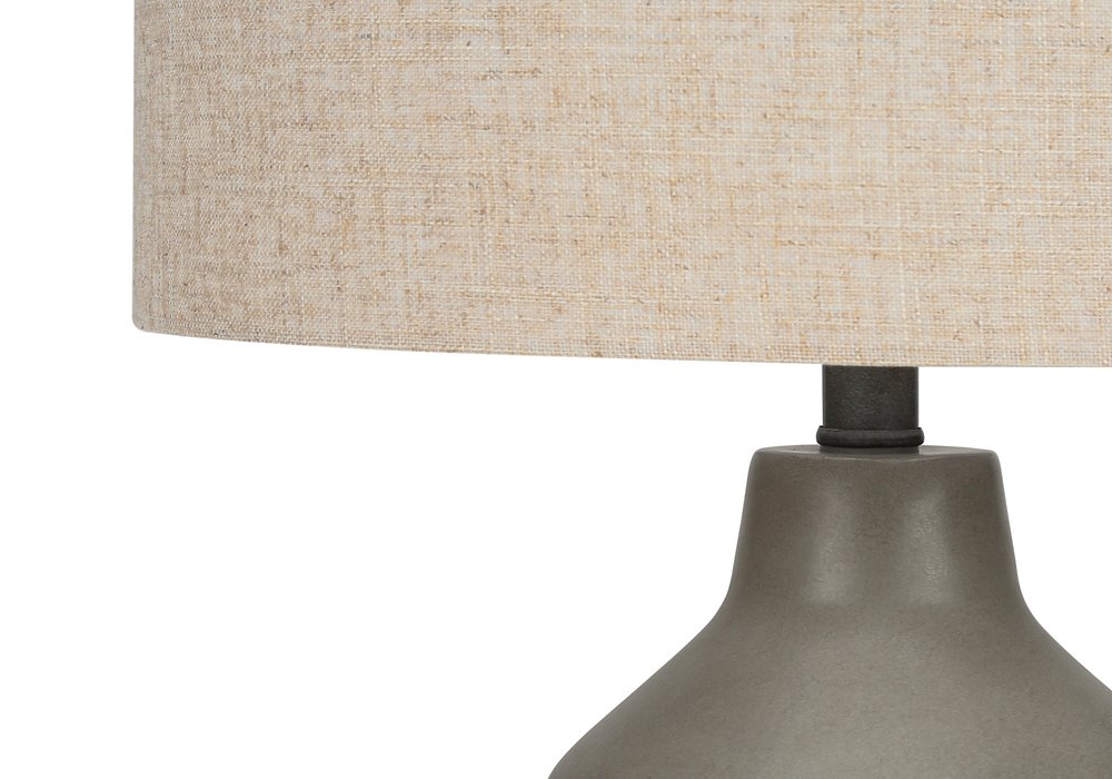 24" Gray Concrete Urn Table Lamp With Beige Drum Shade. Table lamp in beige.