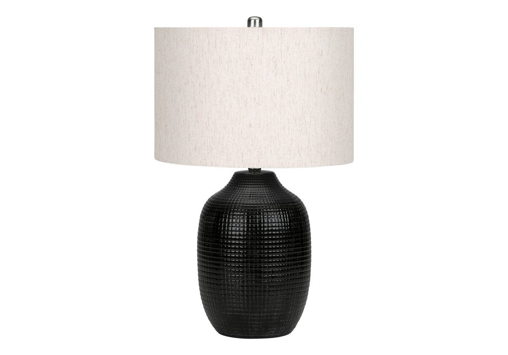 26" Black Ceramic Urn Table Lamp With Ivory Drum Shade. Table lamp isolated on a plain white background, in a ivory ceramic finish.
