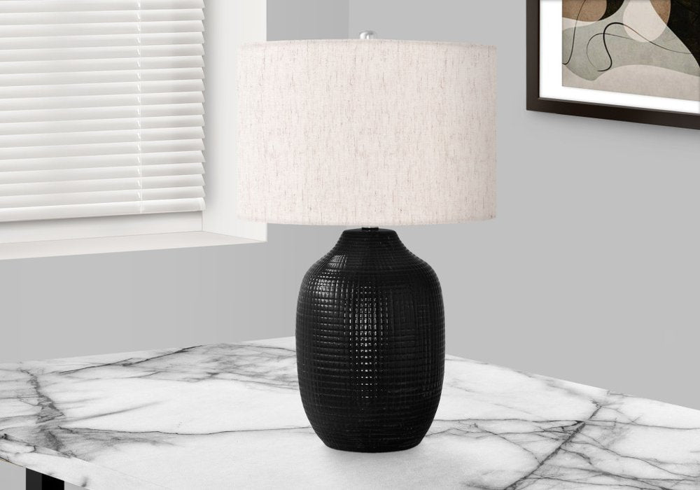 26" Black Ceramic Urn Table Lamp With Ivory Drum Shade. Table lamp in ivory ceramic.