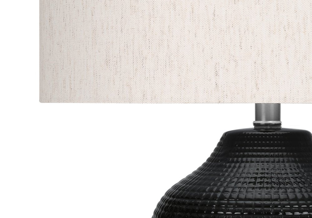 26" Black Ceramic Urn Table Lamp With Ivory Drum Shade. Table lamp in ivory ceramic.