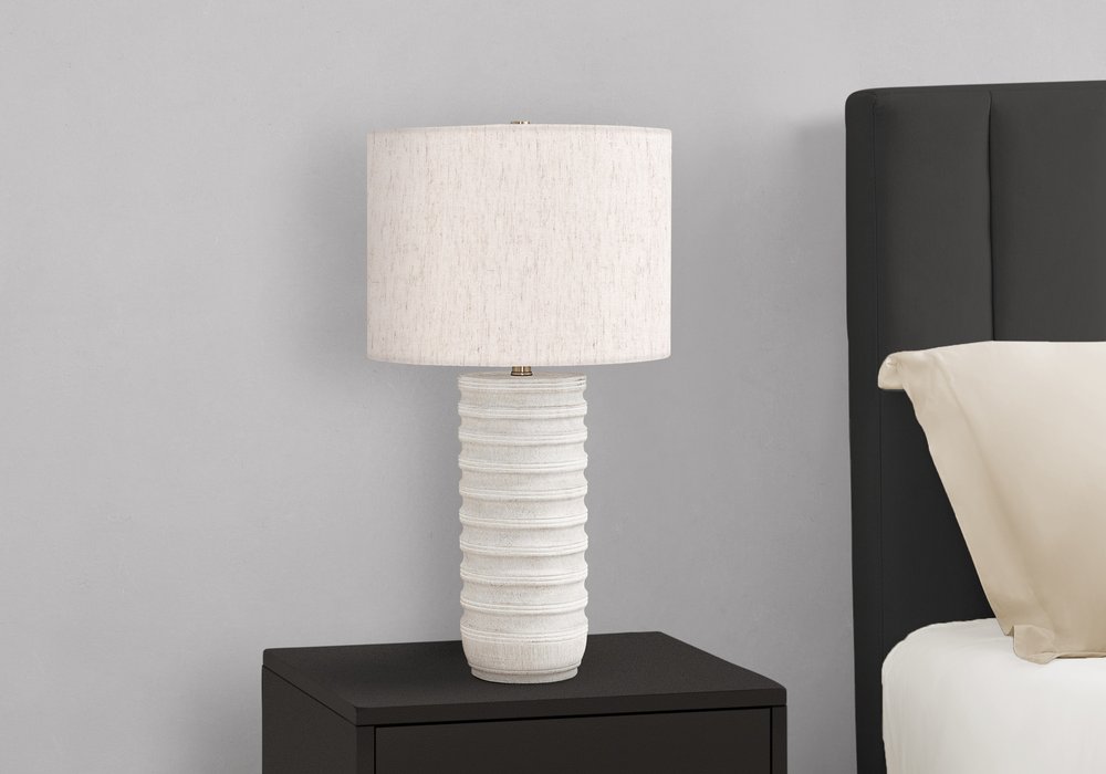 28" Cream Cylinder Table Lamp With Cream Drum Shade. Table lamp isolated on a plain white background.