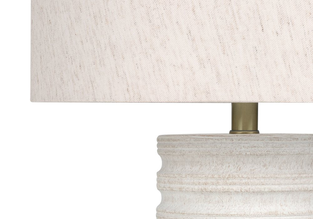 28" Cream Cylinder Table Lamp With Cream Drum Shade. Table lamp isolated on a plain white background, in a cream finish.