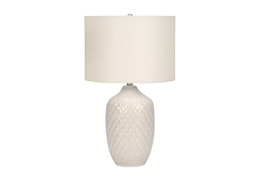 25" Cream Ceramic Urn Table Lamp With Cream Drum Shade. Table lamp isolated on a plain white background, showing a cream ceramic surface.