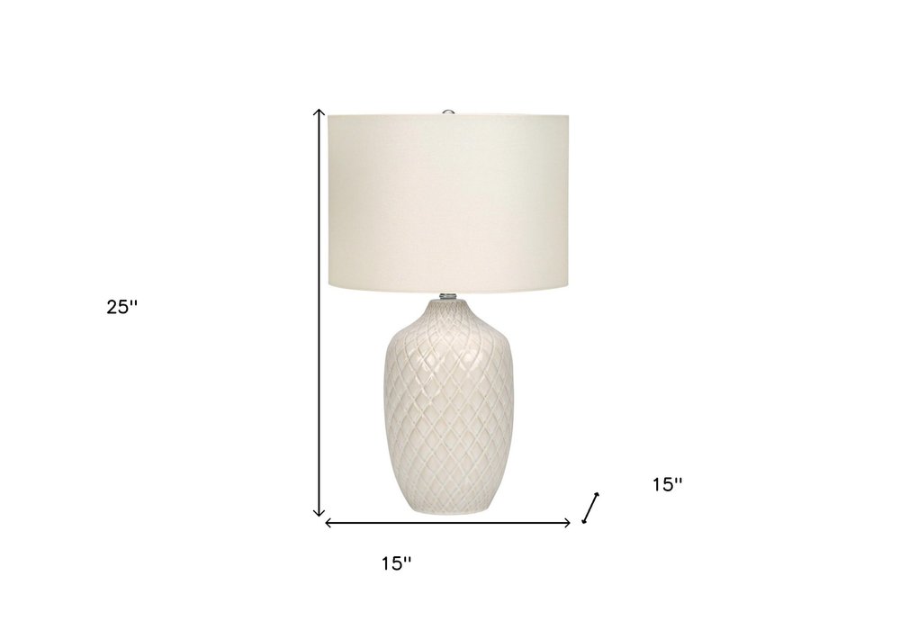 25" Cream Ceramic Urn Table Lamp With Cream Drum Shade. Table lamp isolated on a plain white background, finished in cream ceramic.