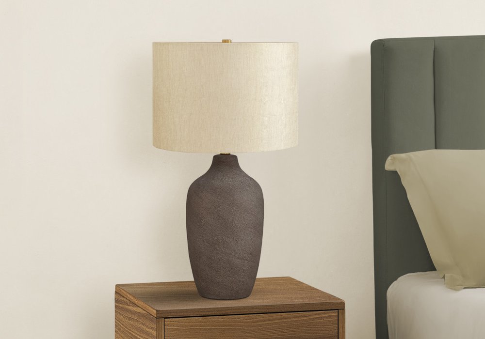 27" Gray Ceramic Urn Table Lamp With Beige Drum Shade. Table lamp isolated on a plain white background, finished in beige ceramic.
