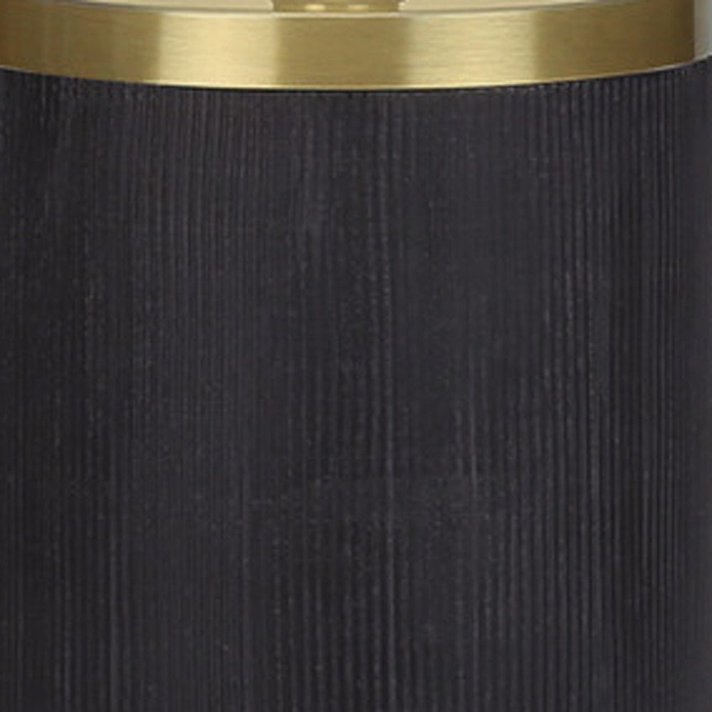 Close-up of 24" Black and Gold Concrete Cylinder Table Lamp With Ivory Drum Shade showing the gold texture.