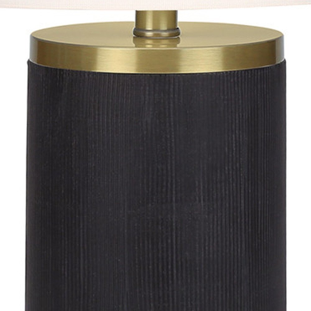 24" Black and Gold Concrete Cylinder Table Lamp With Ivory Drum Shade. Table lamp isolated on a plain white background, showing its gold color.
