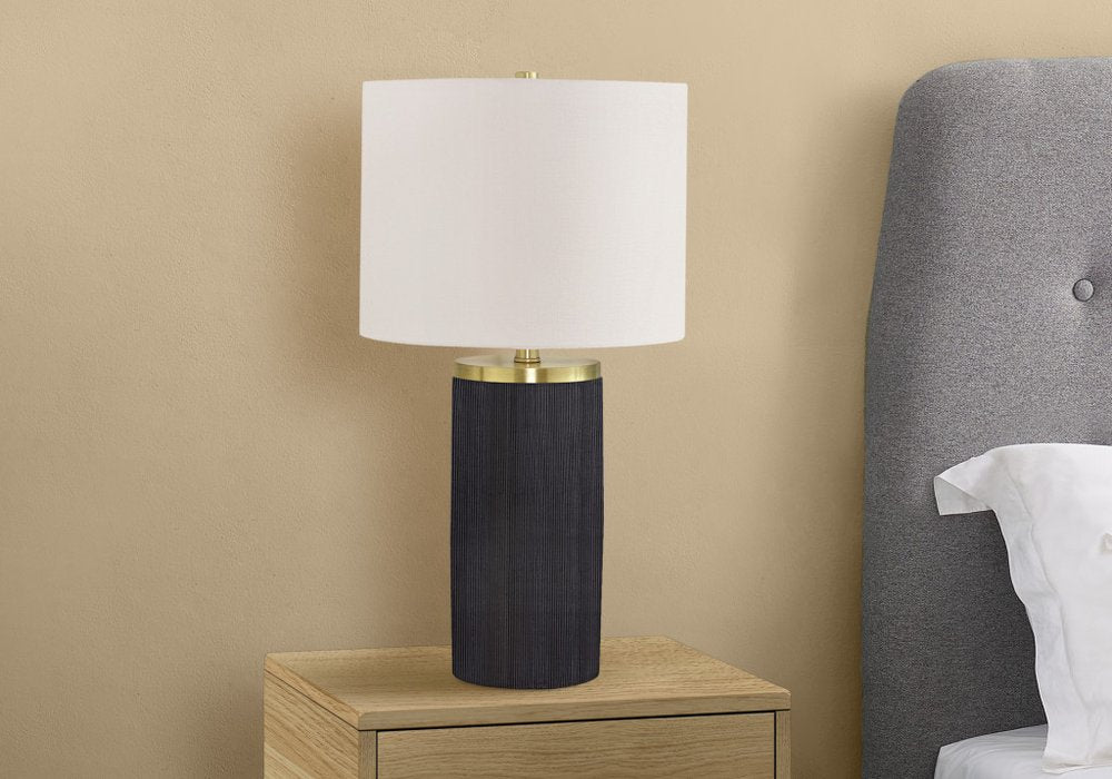 24" Black and Gold Concrete Cylinder Table Lamp With Ivory Drum Shade. Table lamp in ivory.