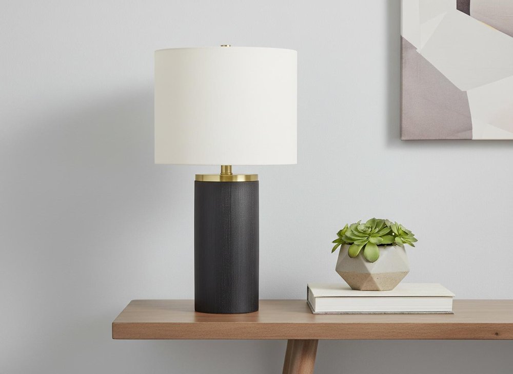 24" Black and Gold Concrete Cylinder Table Lamp With Ivory Drum Shade. Table lamp in ivory.