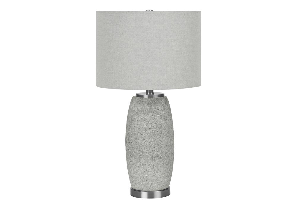 25" Gray and Silver Ceramic Cylinder Table Lamp With Gray Drum Shade. Table lamp isolated on a plain white background, showing a silver ceramic surface.