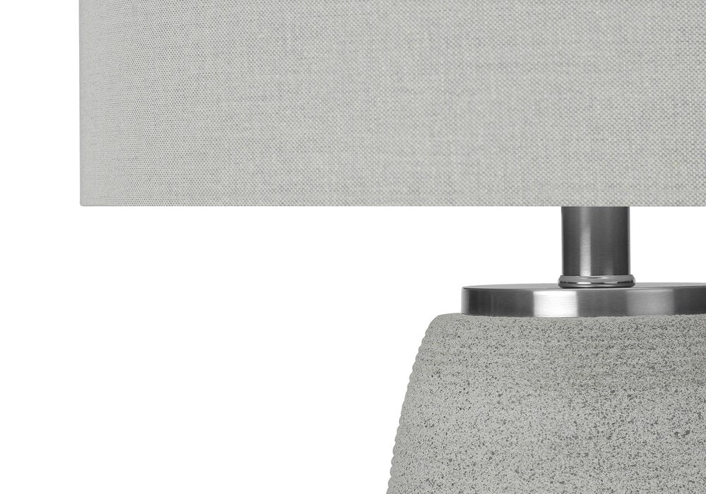 25" Gray and Silver Ceramic Cylinder Table Lamp With Gray Drum Shade. Table lamp in silver ceramic.
