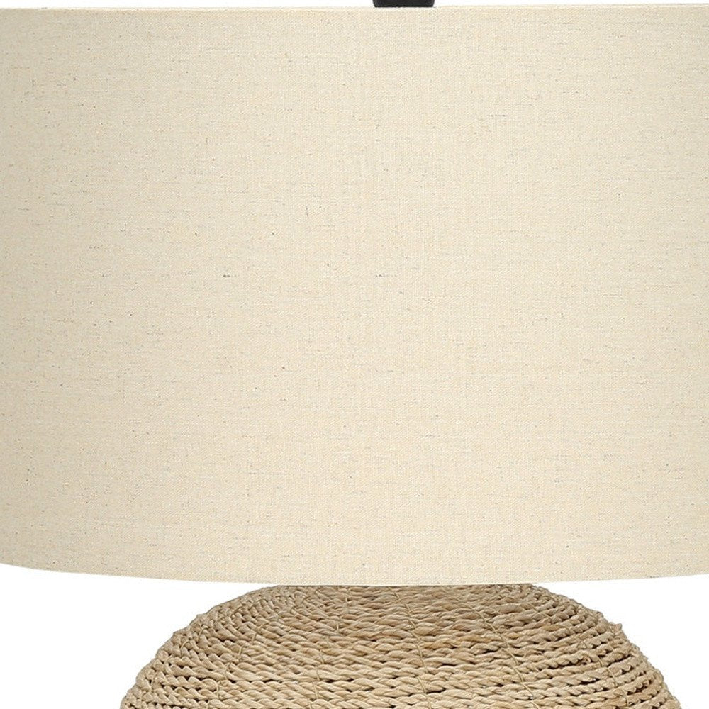 25" Beige Rattan Round Table Lamp With Beige Drum Shade close-up highlighting the beige rattan surface.