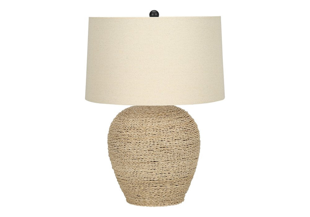 25" Beige Rattan Round Table Lamp With Beige Drum Shade. Table lamp isolated on a plain white background, showing a beige rattan surface.