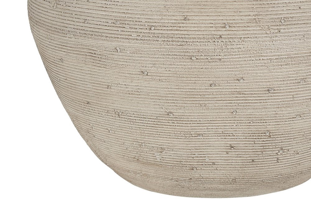 25" Cream Concrete Round Table Lamp With Beige Drum Shade. Table lamp isolated on a plain white background, finished in cream.