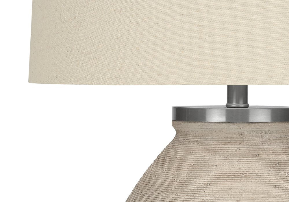 25" Cream Concrete Round Table Lamp With Beige Drum Shade. Table lamp in cream.