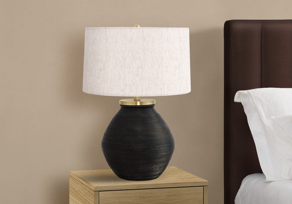 Close-up of 25" Black and Gold Concrete Round Table Lamp With Ivory Drum Shade showing the ivory texture.