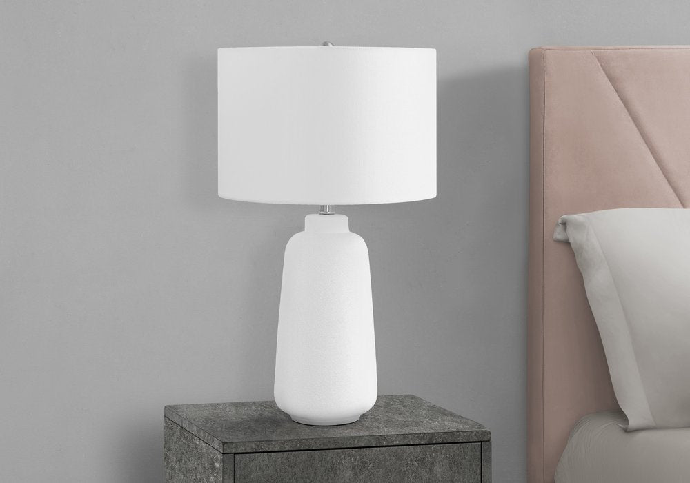 Detail view of 26" Cream Ceramic Cylinder Table Lamp With Cream Drum Shade, filling the frame with the cream ceramic texture.