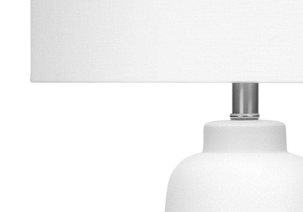 26" Cream Ceramic Cylinder Table Lamp With Cream Drum Shade. Table lamp isolated on a plain white background, finished in cream ceramic.