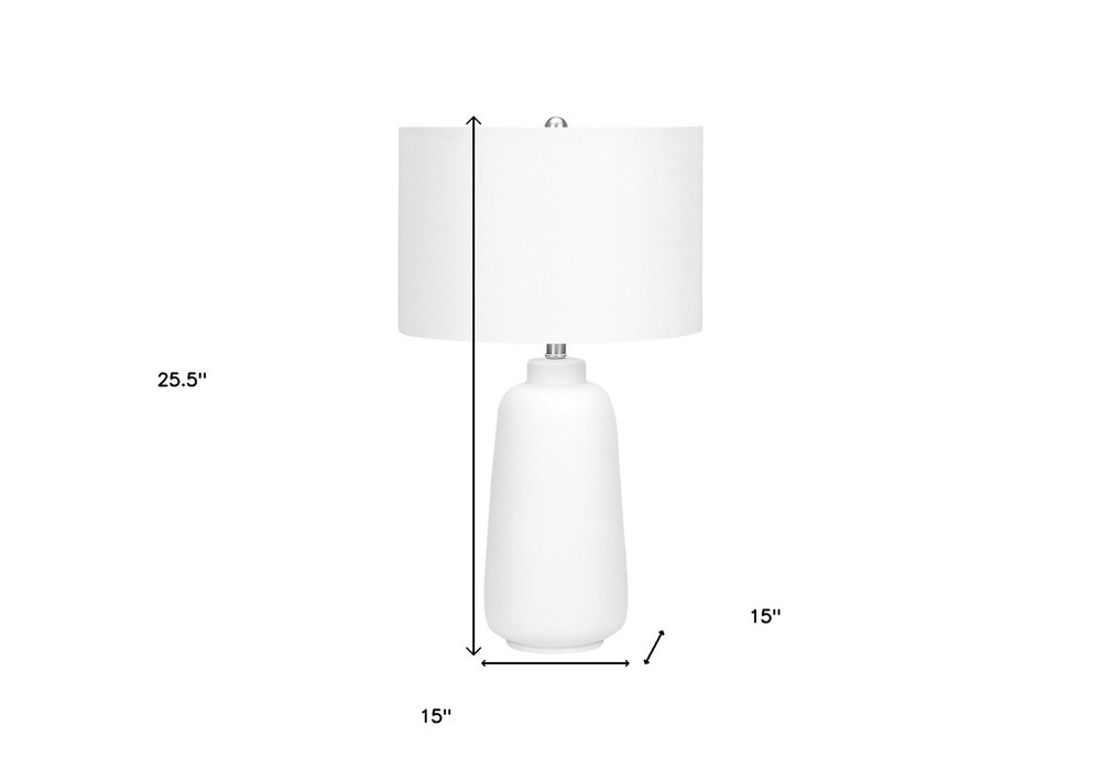26" Cream Ceramic Cylinder Table Lamp With Cream Drum Shade. Table lamp isolated on a plain white background, in a cream ceramic finish.