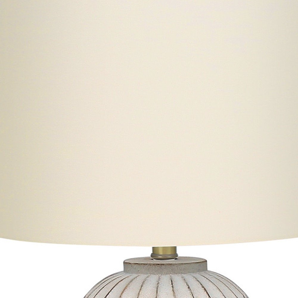 Close-up of 24" Cream Geometric Table Lamp With Cream Drum Shade showing cream detail.