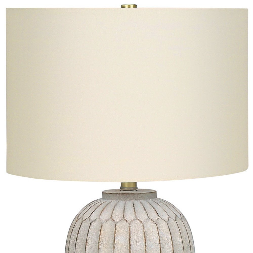 24" Cream Geometric Table Lamp With Cream Drum Shade. Table lamp isolated on a plain white background, showing its cream color.