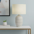 24" Cream Geometric Table Lamp With Cream Drum Shade. Table lamp in cream.