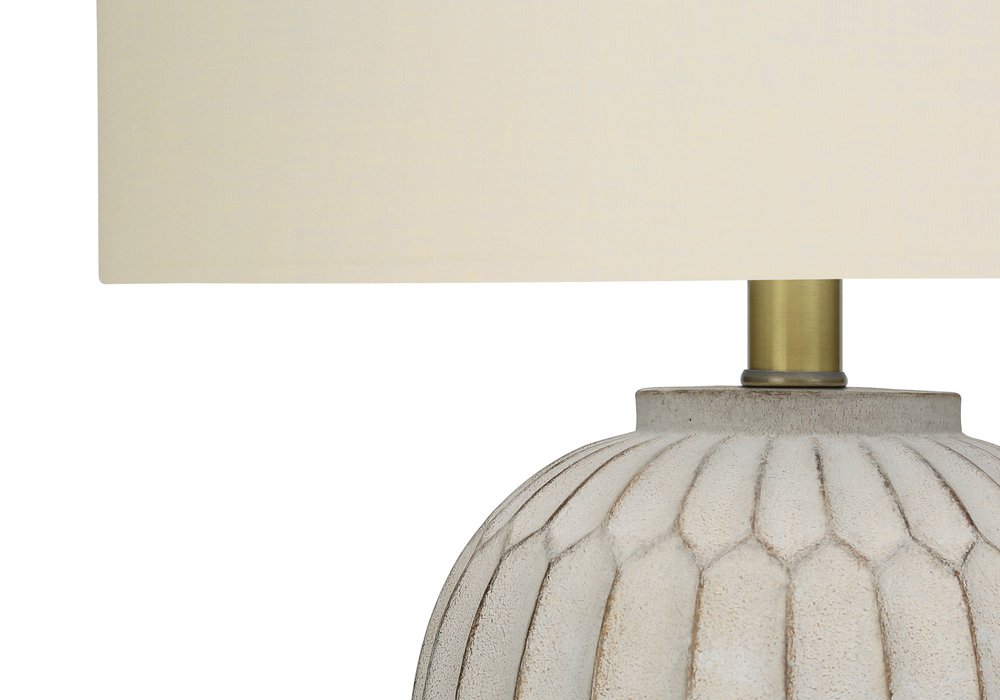 24" Cream Geometric Table Lamp With Cream Drum Shade. Table lamp in cream.