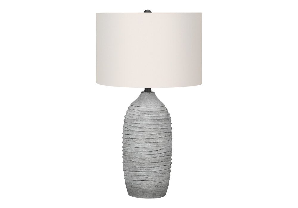 27" Gray Cylinder Table Lamp With Ivory Drum Shade. Table lamp isolated on a plain white background, showing its ivory color.