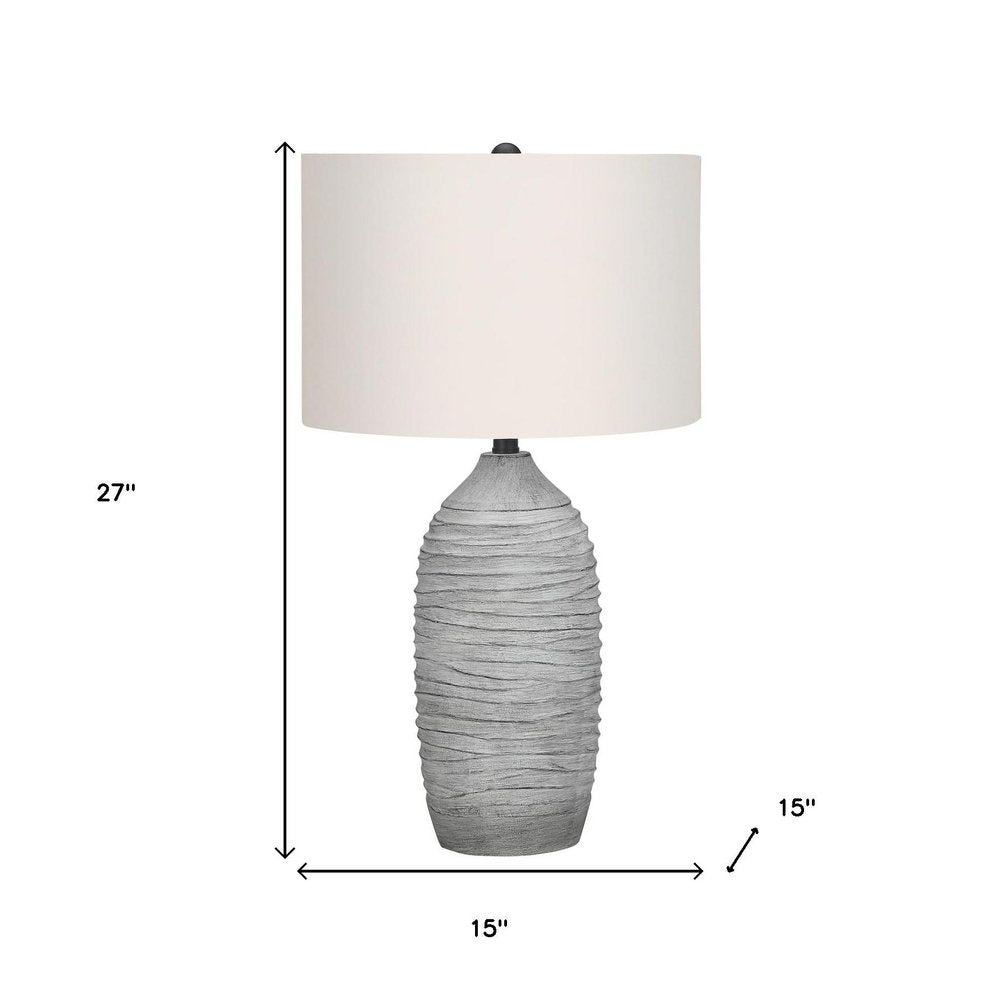 27" Gray Cylinder Table Lamp With Ivory Drum Shade. Table lamp isolated on a plain white background, finished in ivory.