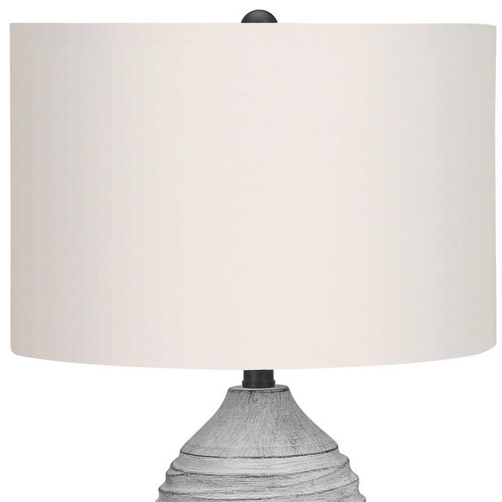 27" Gray Cylinder Table Lamp With Ivory Drum Shade. Table lamp isolated on a plain white background, finished in ivory.