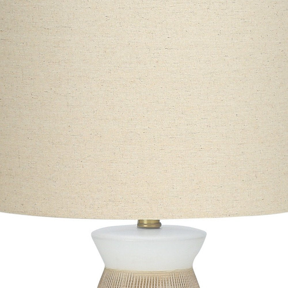 27" Brown and White Ceramic Round Table Lamp With Beige Drum Shade detail shot of the beige ceramic finish.