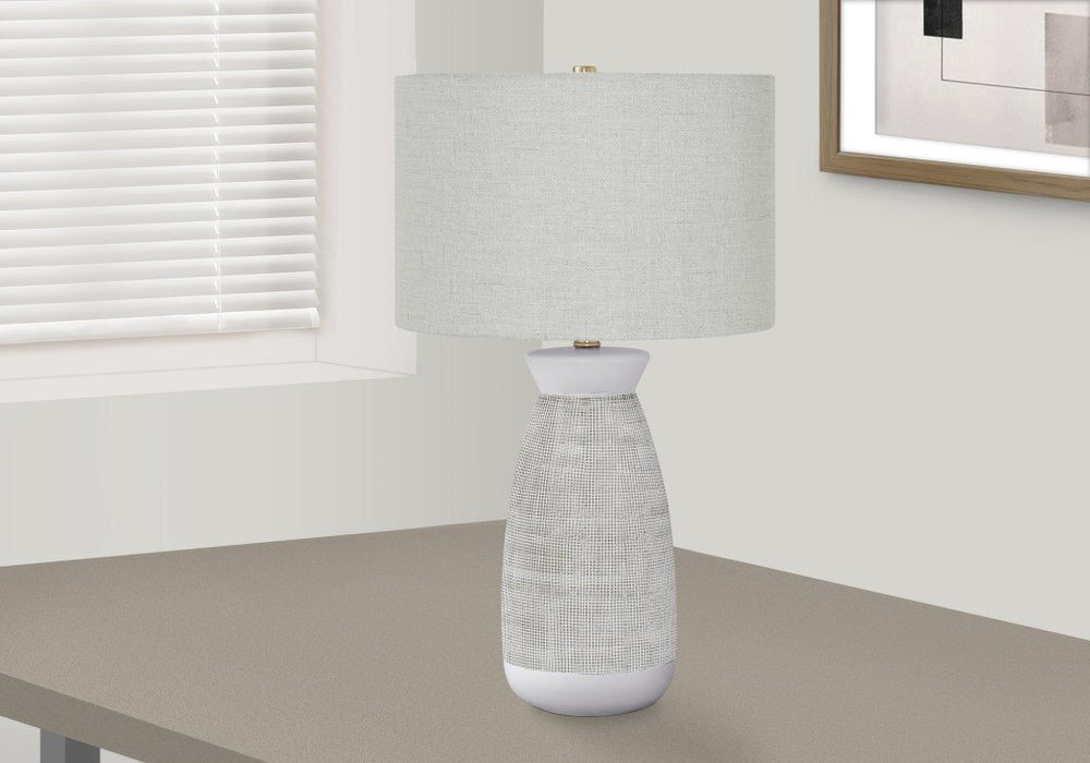 Close-up of 27" Gray and White Ceramic Round Table Lamp With Gray Drum Shade showing the white ceramic texture.