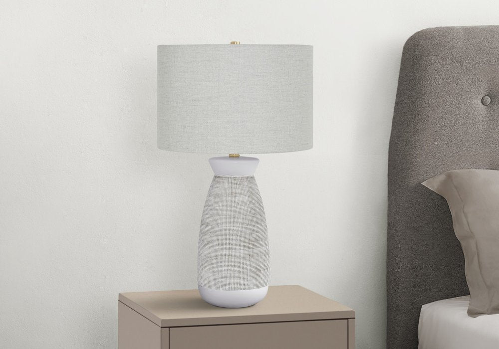 Detail view of 27" Gray and White Ceramic Round Table Lamp With Gray Drum Shade, filling the frame with the white ceramic texture.