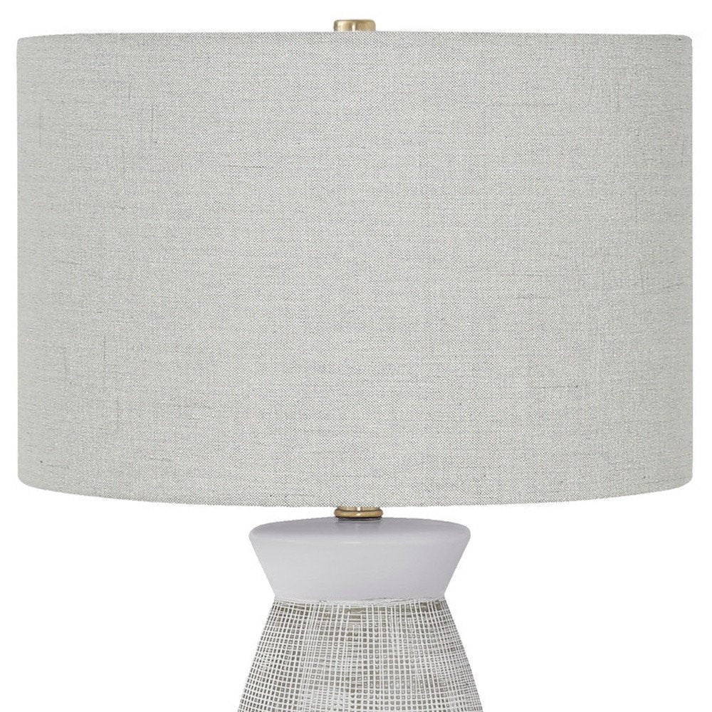 27" Gray and White Ceramic Round Table Lamp With Gray Drum Shade. Table lamp isolated on a plain white background, in a white ceramic finish.