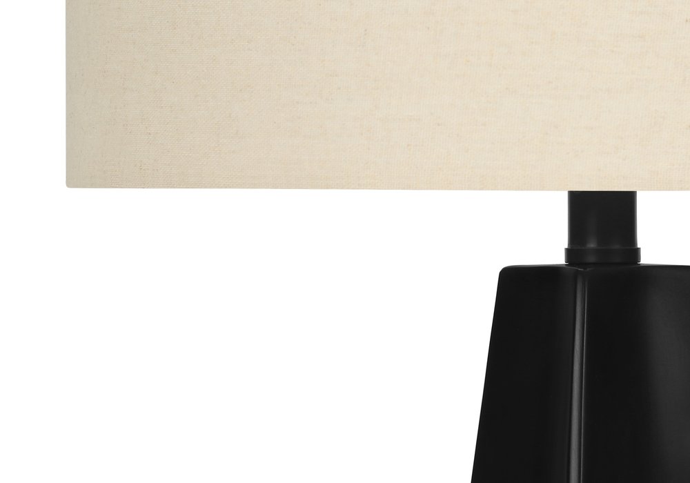 27" Black Geometric Table Lamp With Beige Drum Shade. Table lamp in beige.