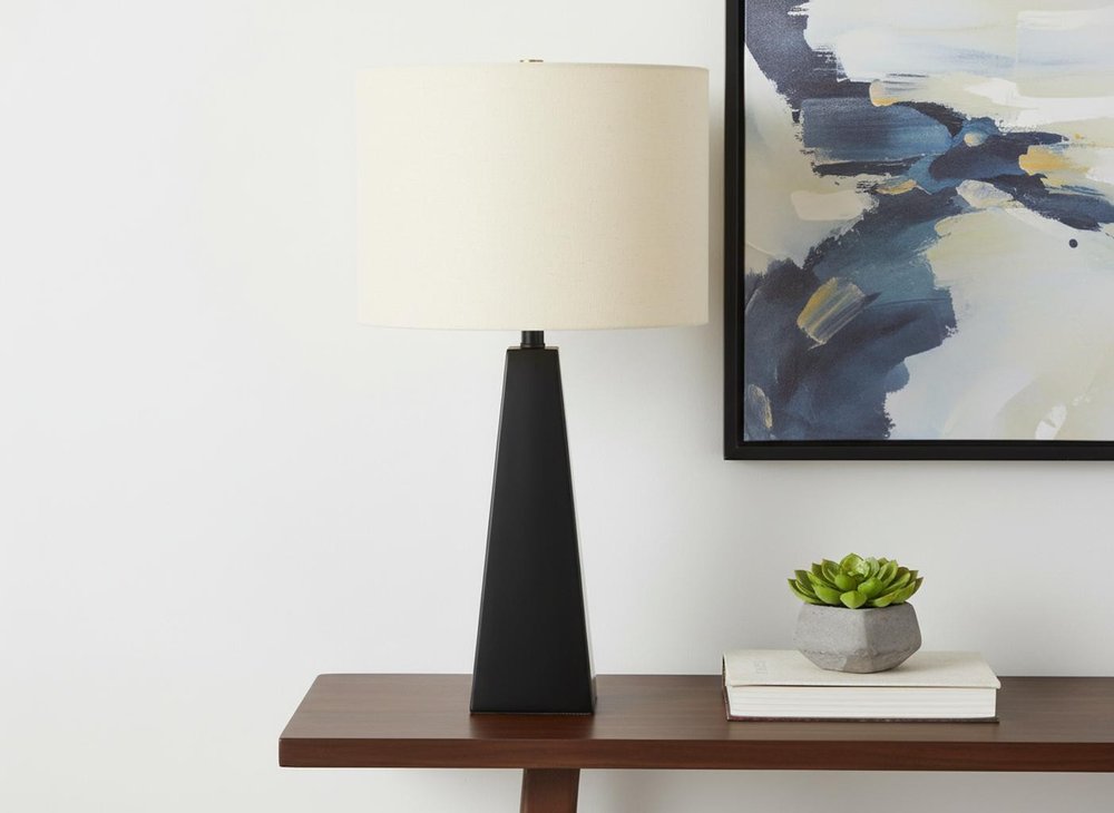 27" Black Geometric Table Lamp With Beige Drum Shade. Table lamp in beige.