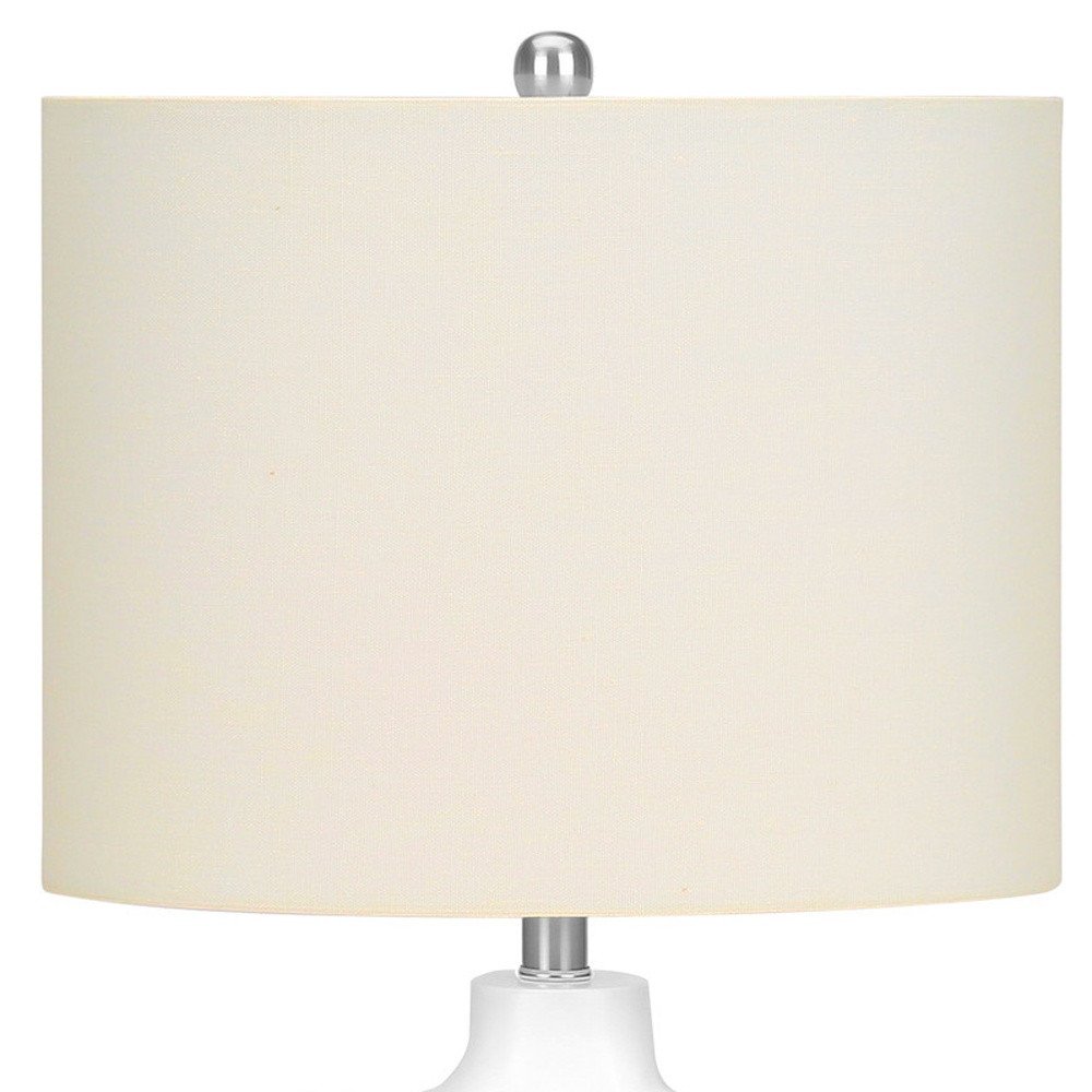 25" Cream Novelty Table Lamp With Cream Drum Shade. Table lamp isolated on a plain white background, finished in cream.