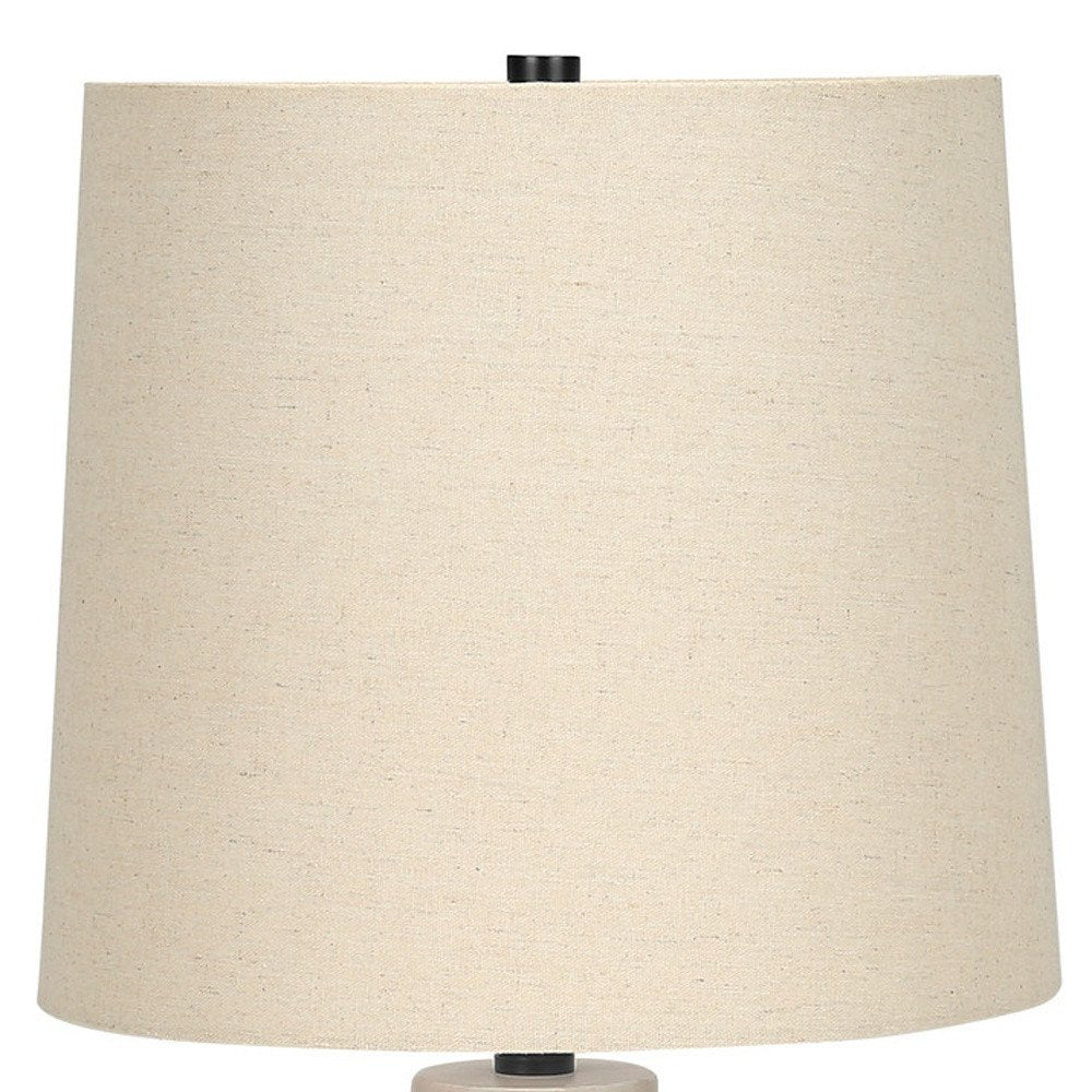 25" Cream Geometric Table Lamp With Beige Empire Shade. Table lamp isolated on a plain white background, in a cream finish.