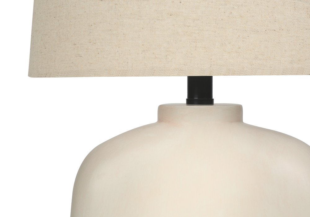25" Cream Geometric Table Lamp With Beige Empire Shade. Table lamp isolated on a plain white background, in a cream finish.
