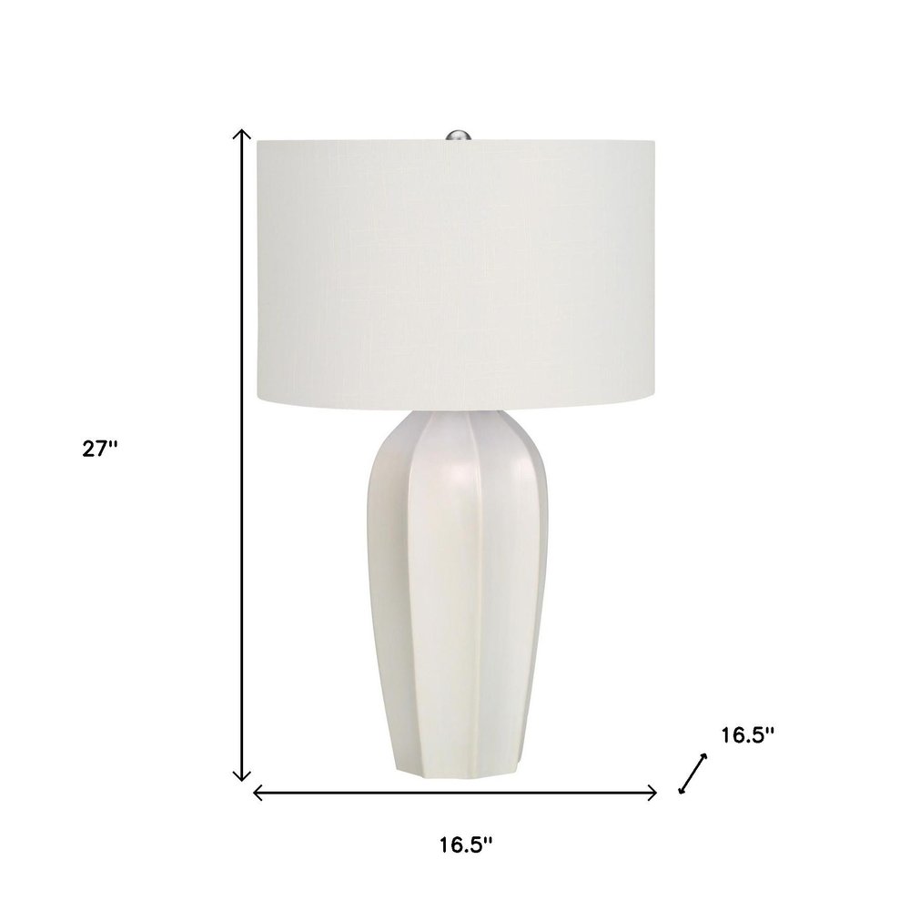 27" Cream Ceramic Geometric Table Lamp With Cream Drum Shade. Table lamp isolated on a plain white background, showing a cream ceramic surface.