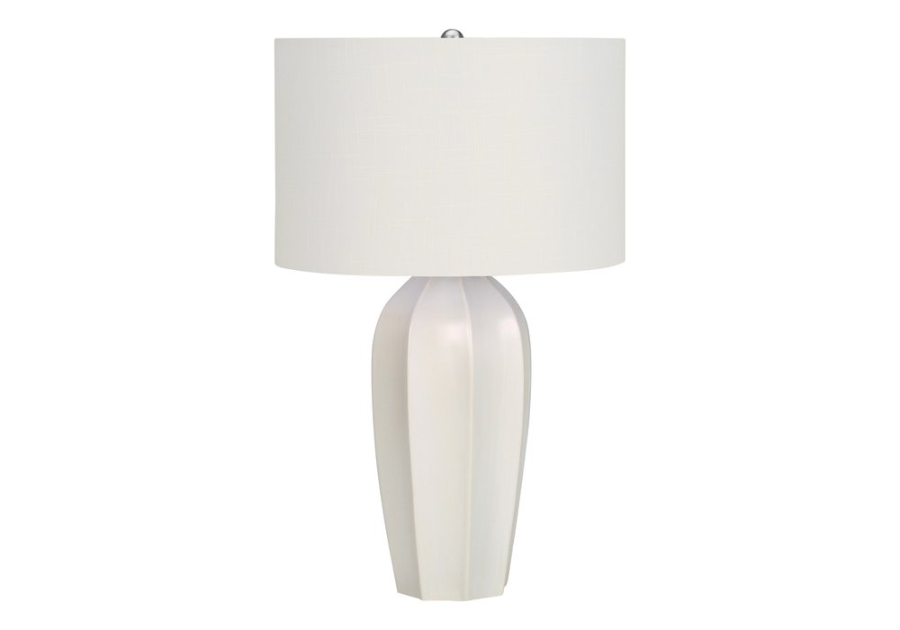 27" Cream Ceramic Geometric Table Lamp With Cream Drum Shade. Table lamp isolated on a plain white background, showing a cream ceramic surface.