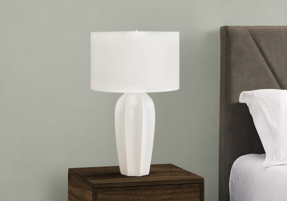 27" Cream Ceramic Geometric Table Lamp With Cream Drum Shade. Table lamp isolated on a plain white background, finished in cream ceramic.