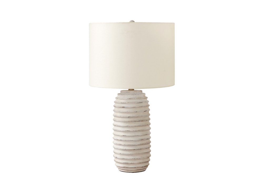 28" Cream Geometric Table Lamp With Cream Drum Shade. Table lamp isolated on a plain white background, in a cream finish.