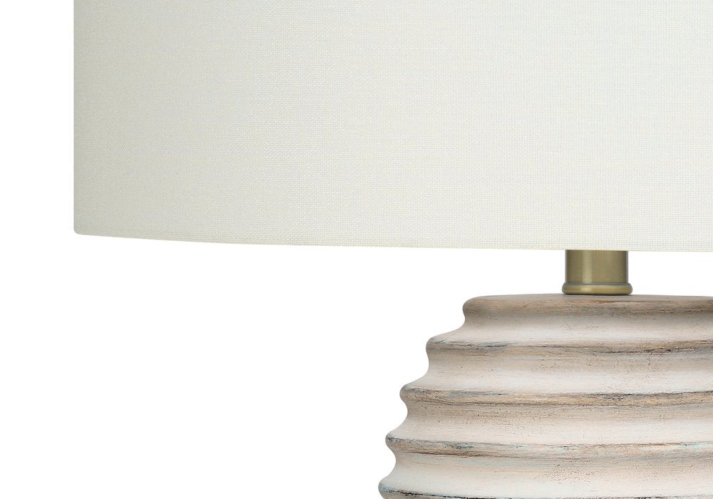 28" Cream Geometric Table Lamp With Cream Drum Shade. Table lamp isolated on a plain white background, showing its cream color.