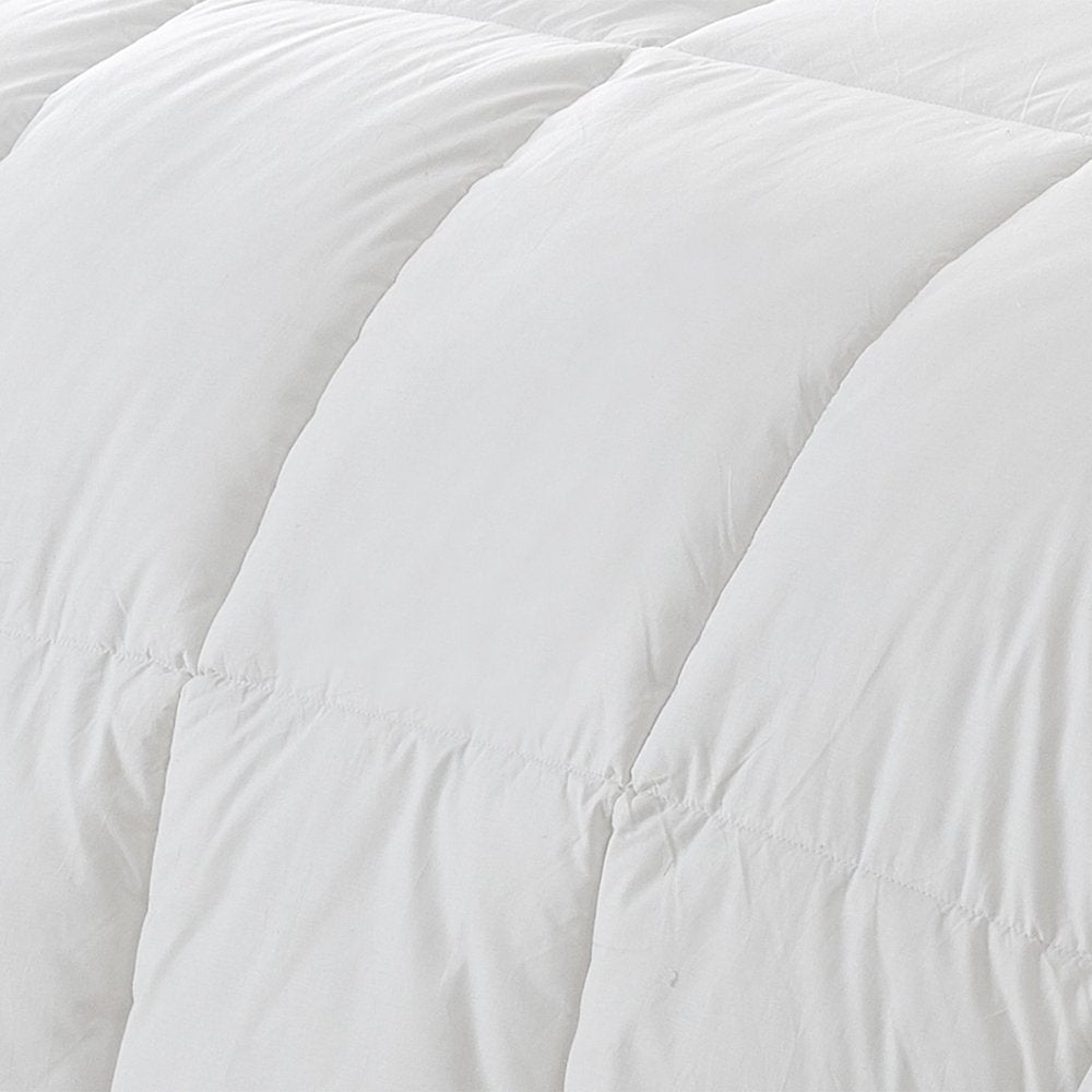Close-up of a white twin goose down comforter with visible stitching and quilted texture.