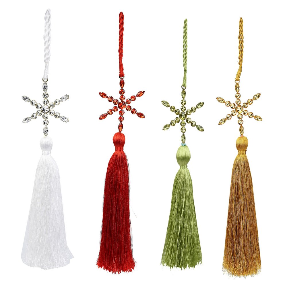 Four snowflake tassel ornaments in white, red, green, and gold, hanging against a white background.