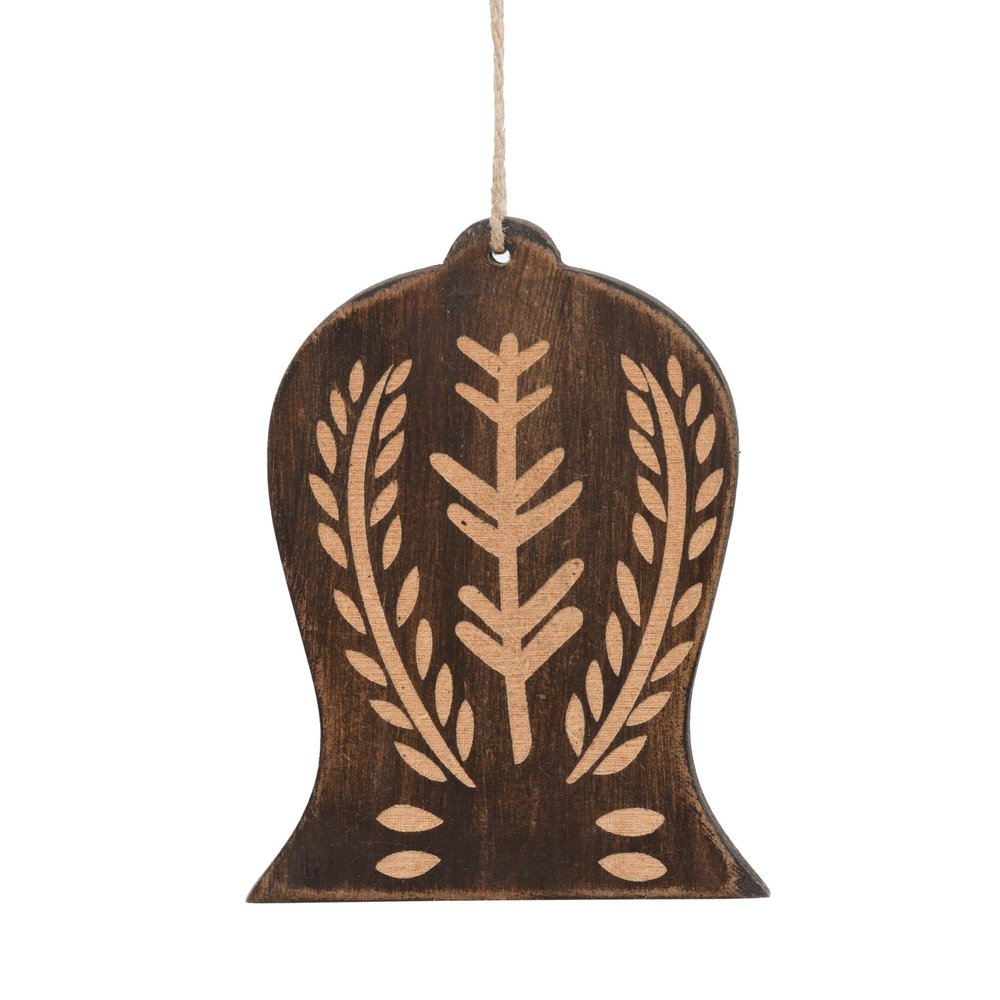 Brown wooden bell-shaped ornament with carved wheat and tree design, hanging from twine against a white background.